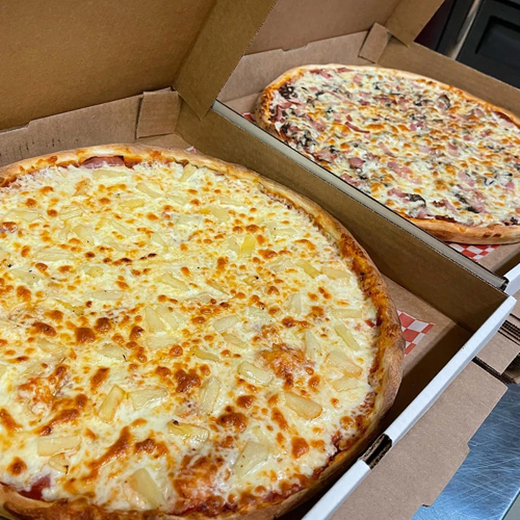 Handmade specialty pizza ready for takeout at Triple C Pizzeria in St. James, Winnipeg